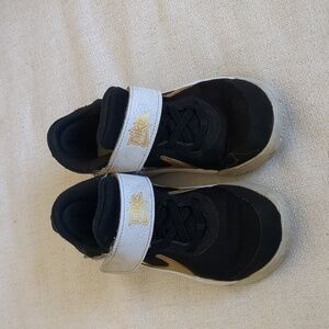Nike kids basketball sneakers size us12 black and gold